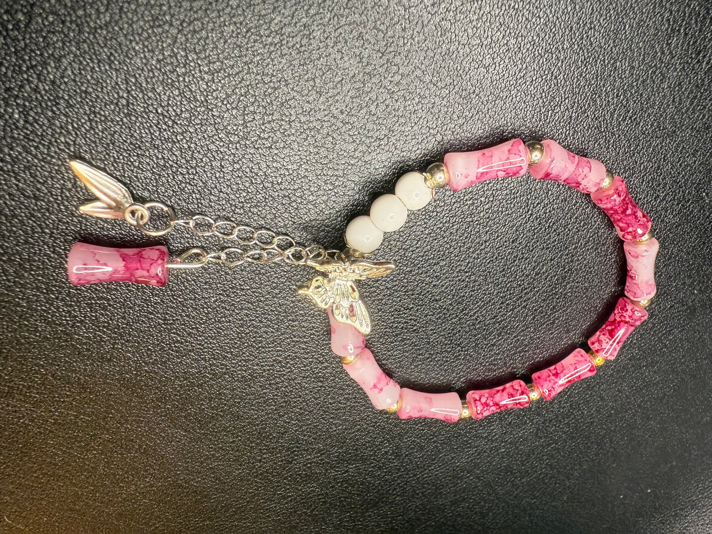 Handcrafted pink beaded bracelet with butterfly