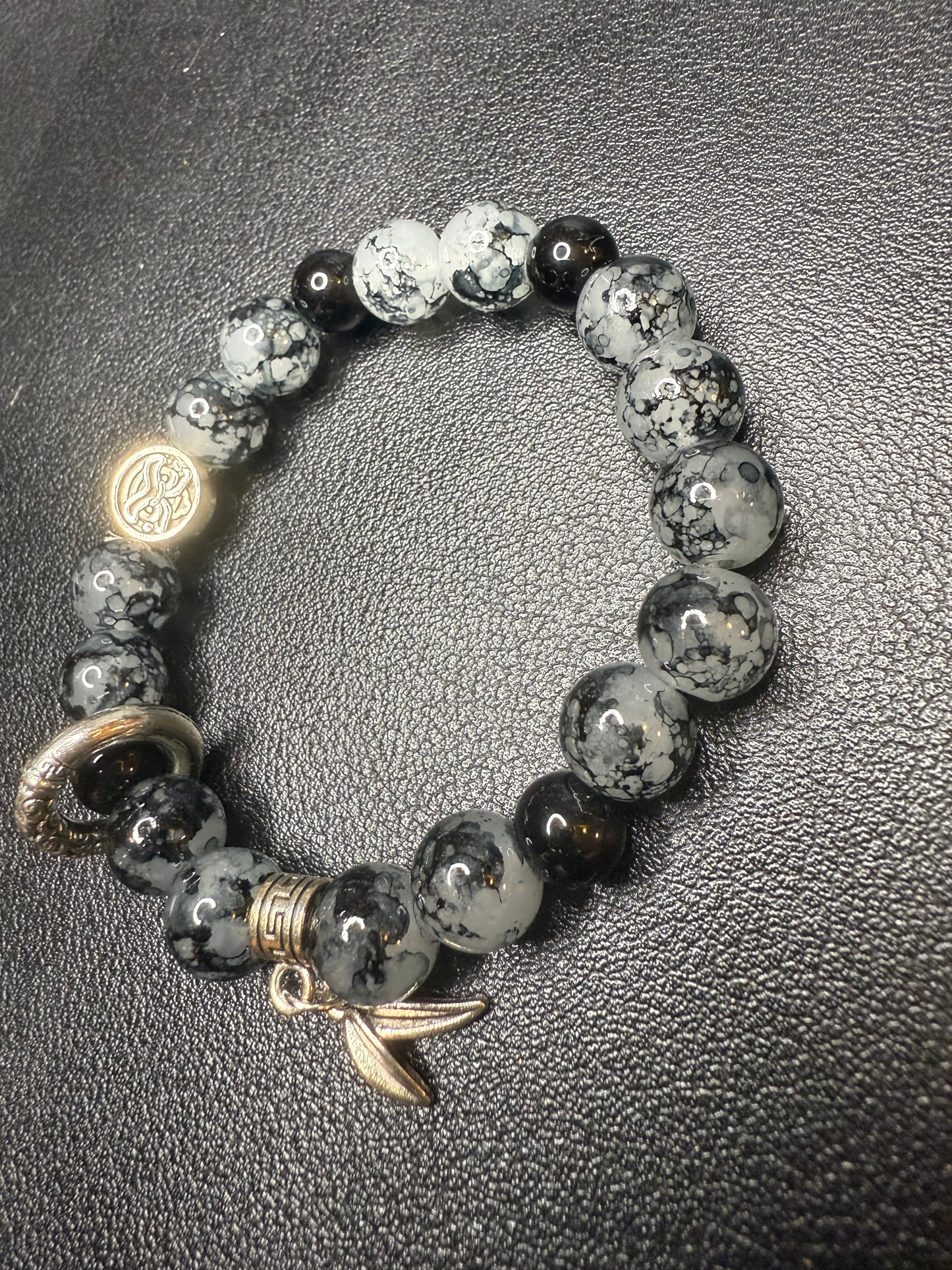 Black glass beads with metal accents