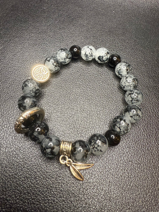 Black glass beads with metal accents