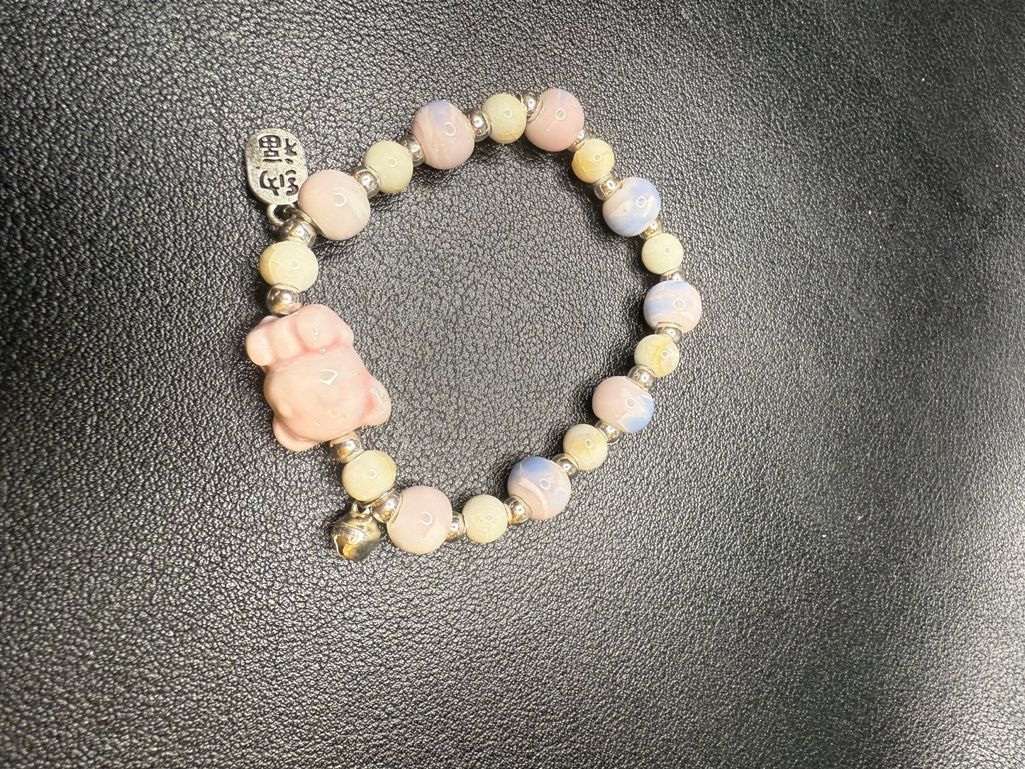 Handcrafted ceramic beaded bracelet with teddy bear
