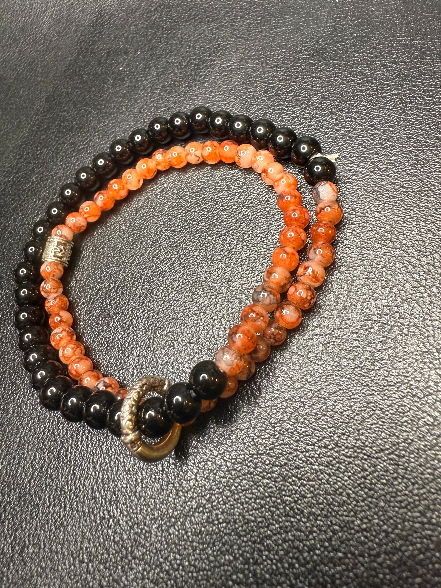 Handcrafted ceramic, glass, and metal beaded bracelet set