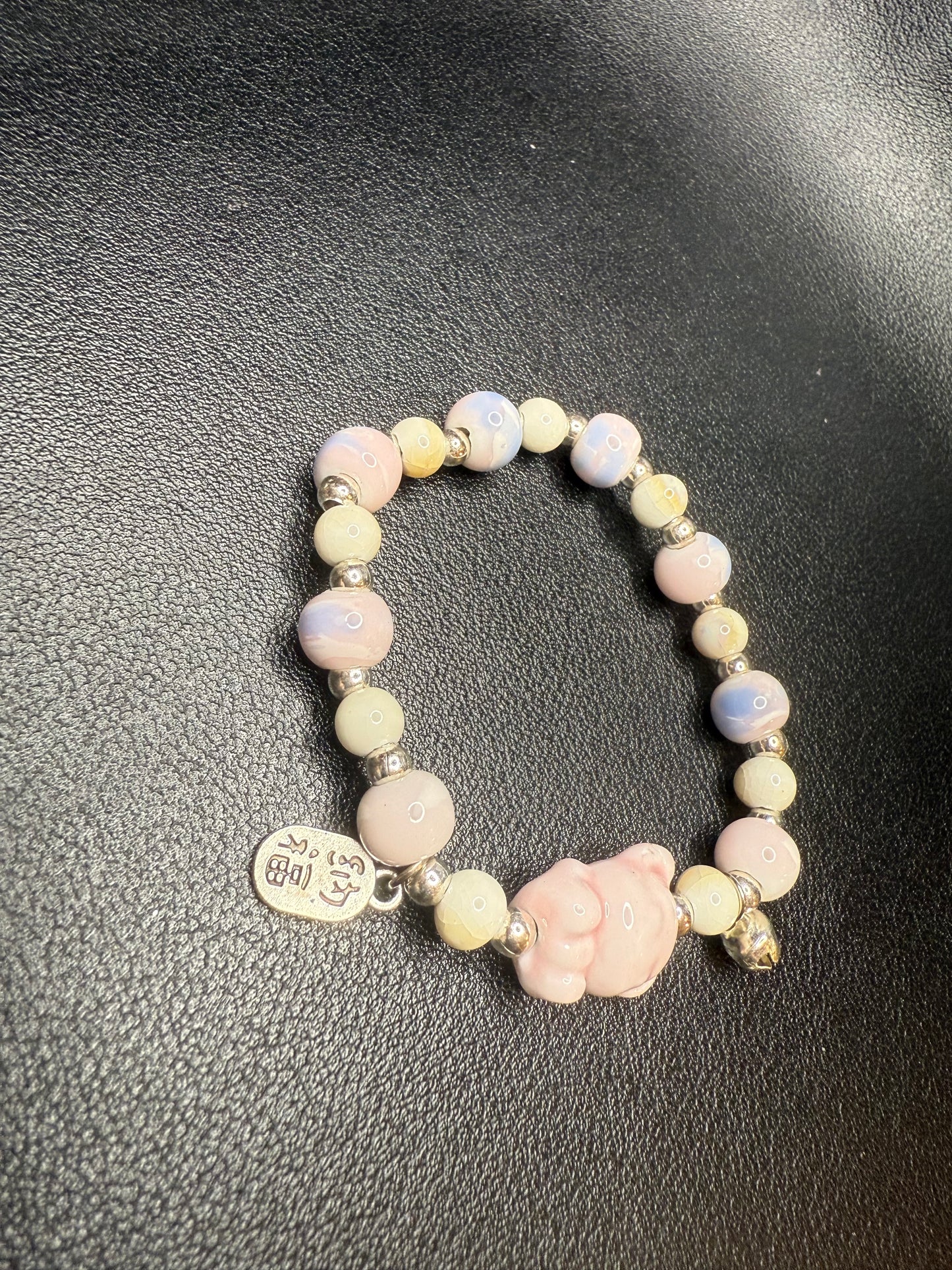 Handcrafted ceramic beaded bracelet with teddy bear