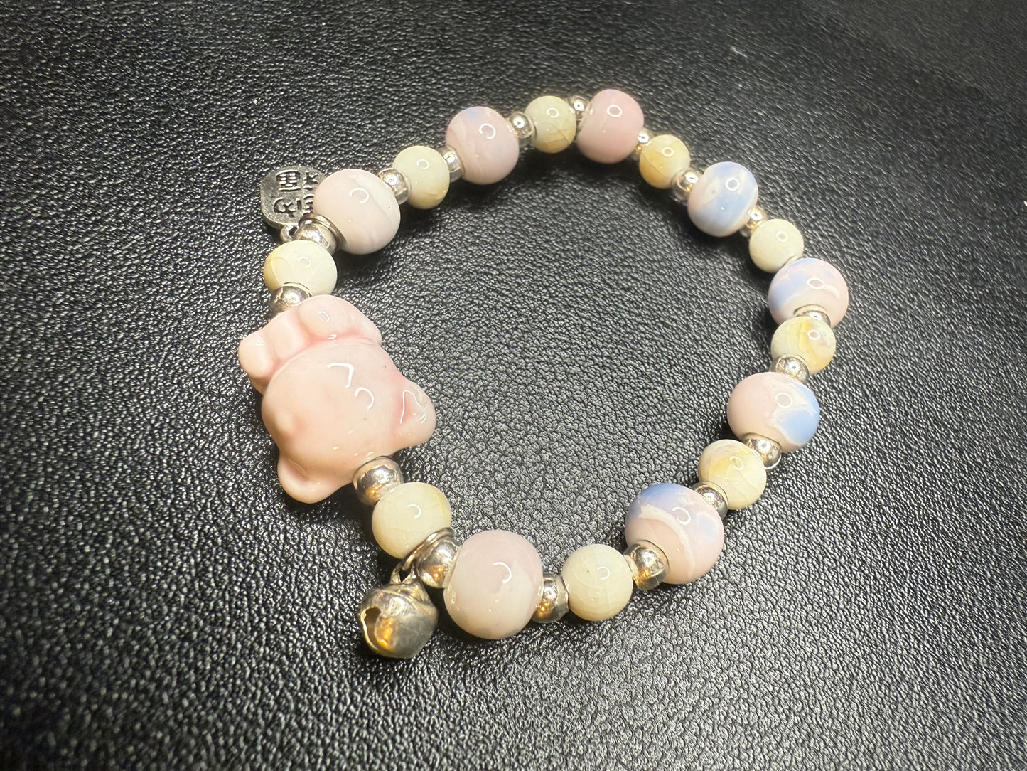 Handcrafted ceramic beaded bracelet with teddy bear