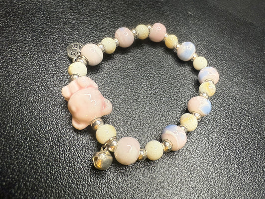 Handcrafted ceramic beaded bracelet with teddy bear