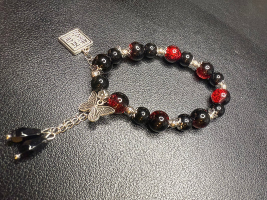 Red glass bead bracelet with metal accents