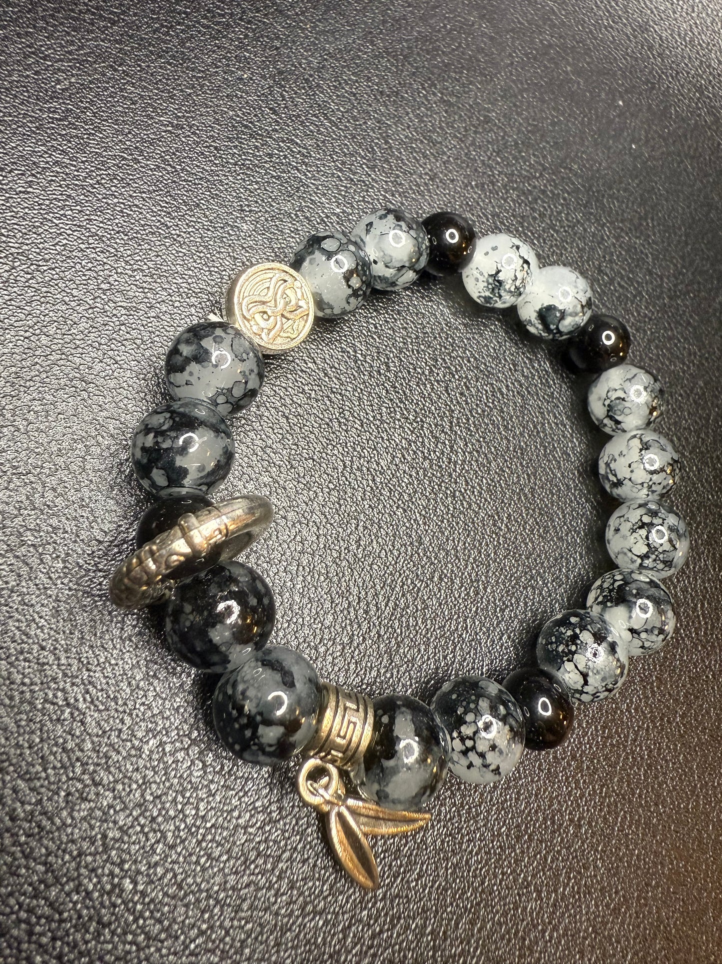 Black glass beads with metal accents